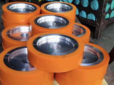 Friction wheels in automobile production lines